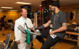 Peter Millett, MD with NFL Player Colin Kaepernick